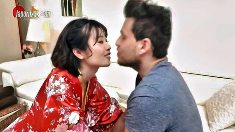 Nene Kinoshita in red kimono kissing interracial partner passionately