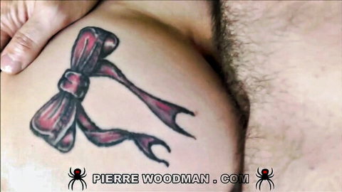 Angie Lynx close-up hip bow tattoo with pubic hair exposure