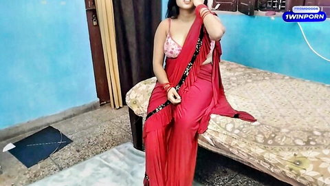 Xxxsoniya in seductive red sari, showcasing cleavage and curves