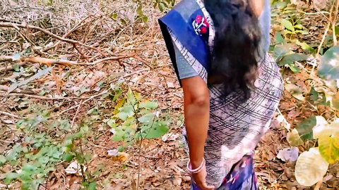Indian MILF Bhabi in saree looking back in woods, desi outdoor tease