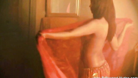 Bollywood babe topless belly dancing with red sari scarf