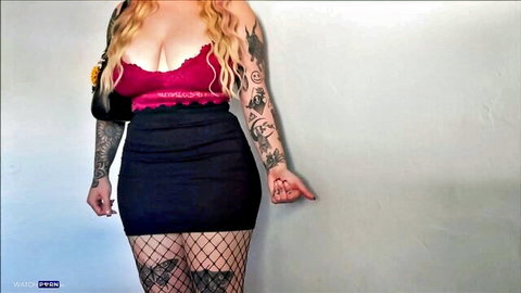 Skylar Vox teasing in red lace top, black mini skirt and fishnets, curvy blonde with tattoos