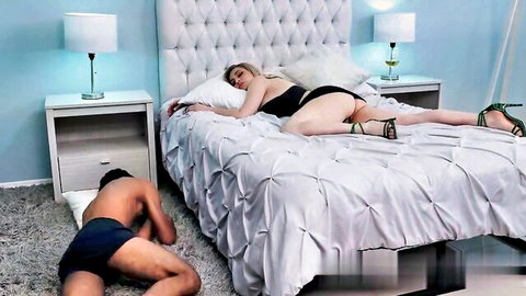 Dana Sofia in black lingerie lying on bed, man kneeling nearby in cousin fantasy