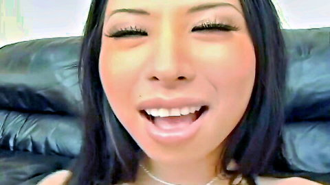 Soolin Asian beauty smiling with open mouth, heavy makeup and black hair