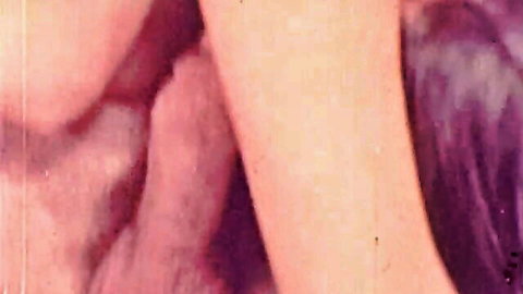 Vintage retro closeup of brunette woman's ecstatic open mouth and face in purple tint