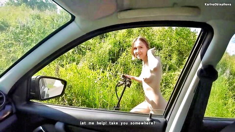 Nude Russian woman leaning from car window, offering teasing ride