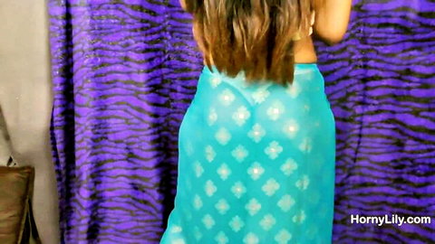 Indian babe in sheer turquoise saree teasing big juicy ass from behind