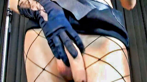 Blue gloved hands spreading fishnet stockings exposing erect cock and balls