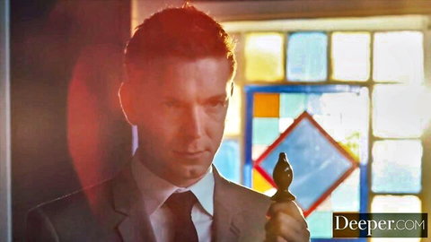 Intense suited master holding scepter in Deeper BDSM scene with Avi Love