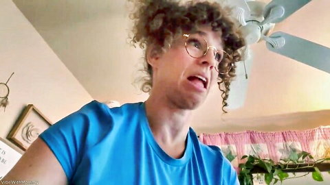 VibeWithMolly as stepmom with curly hair and glasses in blue shirt, surprised expression