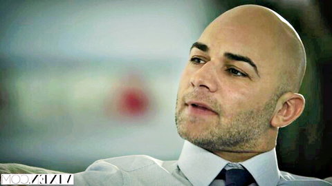 Leah Gotti with intense bald businessman in suit, Vixen scene
