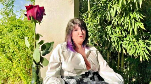 Romy 34yo curvy MILF with purple hair, deep cleavage in open blouse and plaid skirt