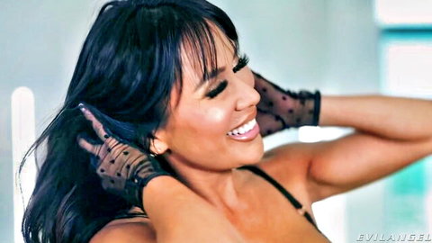 Jena LaRose in sexy black lace gloves and revealing top, smiling seductively