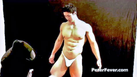 Muscular Asian man in white speedo with hooded figure's hands