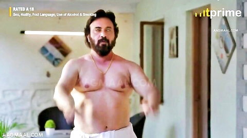 Muscular Indian man shirtless in white pants posing erotically