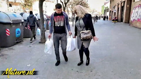 Spanish mature Fina in skirt suit and stockings walking street with partner, Mature NL