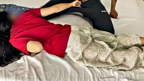 Desi Hancock, naughty stepmom, with huge booty in red top and pants on bed