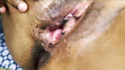 Fingers spreading mature woman's hairy dark pussy wide open exposing wet pink vagina