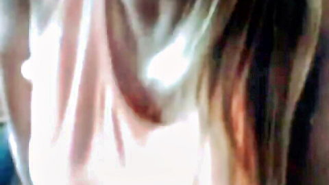Blonde MILF flashing big tits with visible nipple through wet sheer pink top on webcam
