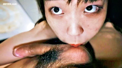 POV closeup of cute Asian girl with wide eyes puckering red lips ready to suck cock blowjob