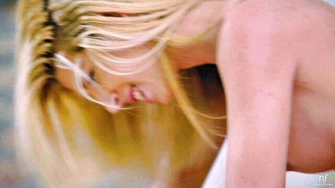 Blonde Missy Luv smiling in nude POV close-up from Nubile Films scene