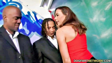 Chanel Preston close with two black men in suits, red dress tease