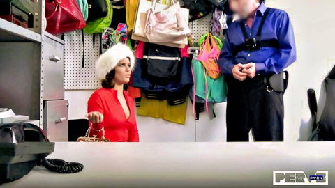 Jesse Pony in sexy red dress and fur hat at shop counter with guard