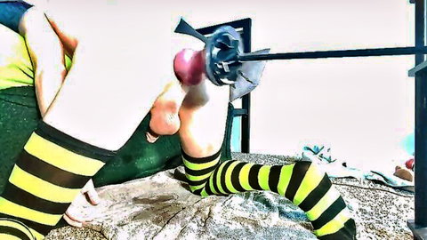 Babe in yellow black striped socks gets red toy fucking machine inserted in shaved pussy solo