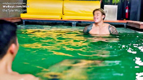 Tyler Wu and Titus Low in steamy bathhouse pool, muscular Asian studs smiling