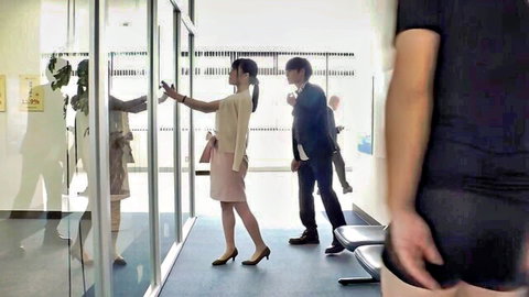 Japanese businesswoman in skirt scanned at office door with suited men nearby, JAV tease