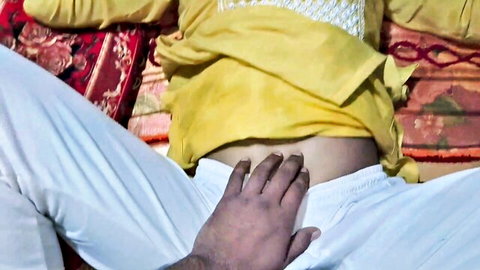 Dark-skinned man's hand fingers spread over exposed Indian woman's shaved pussy closeup