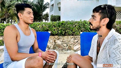Two Latino men chatting intimately on Cancun beach in Wild Cancun 1