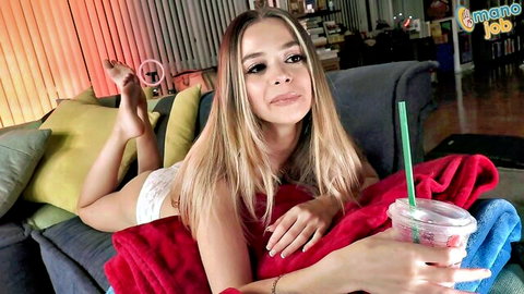 Molly Little lounging topless in white panties after sex, holding Starbucks