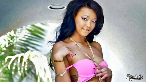 Smiling ebony teen in sexy pink bikini top and jewelry, fun vibe