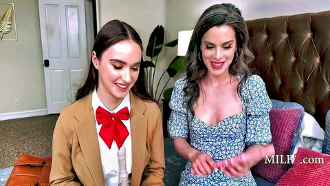 Hazel Moore and Nicole Emma Vaunt smiling in sexy outfits before lesbian strap-on action