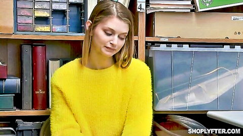 Bunny Colby in yellow fuzzy sweater, pensive pose for Shoplyfter
