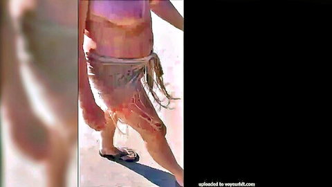 Curvy mature wife walking in Maspalomas dunes with revealing pink top and fringed skirt