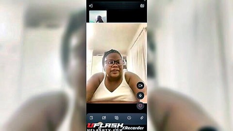 Ebony woman flashing cleavage to tutor in amateur video call