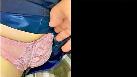 Hand pulls aside pink lace panties exposing shaved pussy closeup