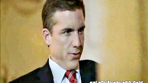 Handsome suited man in professional close-up portrait looking sideways