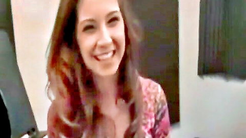 Alexa Jones smiling with cleavage in colorful top