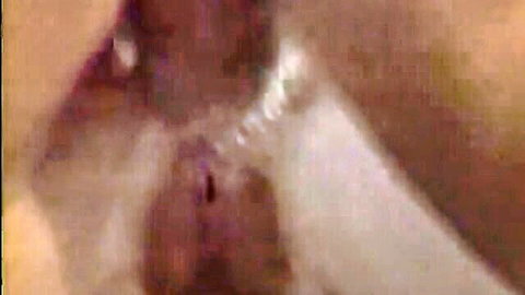Close-up of wet shaved pussy in explicit sex babe video