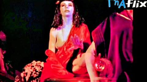 Marjorie Cameron topless in red draped robe, mystical solo scene