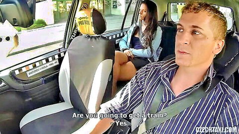 Nata Lee in blue dress chatting seductively in taxi cab