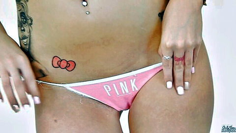 Tattooed young babe pulls pink PINK panties aside teasing shaved pussy mound