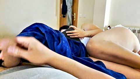 POV closeup of sexy woman's big juicy ass in white panties spread on bed filmed by lover's phone