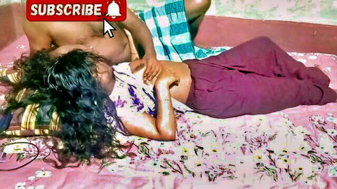 Intimate embrace of lean Indian woman with long hair and shirtless man in bed