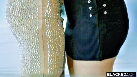 Karly Baker in sexy sparkly dress showing curves with busty model
