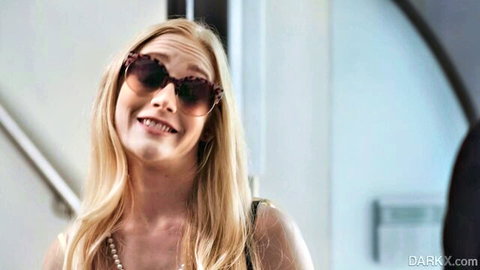 Emma Starletto blonde stunner smiling in sunglasses and pearls