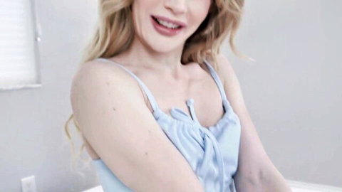 Emma Starletto in sexy blue lingerie, blonde beauty smiling teasingly